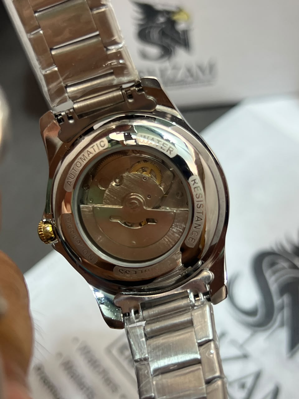 Tisselin Automatic Exhibition Case Back showing Automatic Movement and Water Resistance