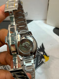 Tisselin Automatic Exhibition Case Back close-up with visible mechanical movement and gold crown