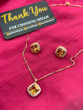 Champagne Topaz Square Crystal Halo Necklace and Earrings Set on red fabric