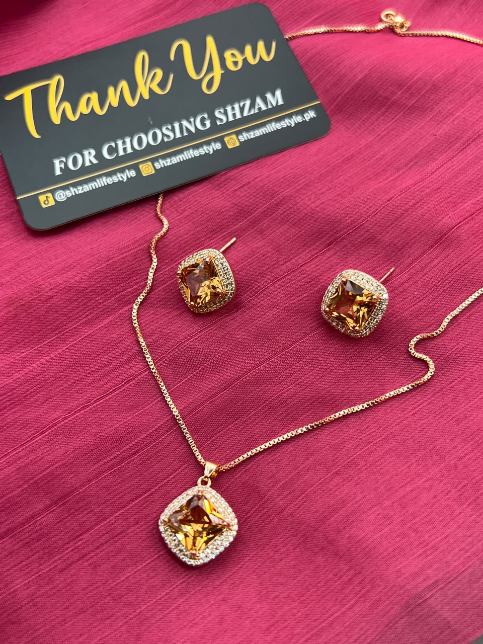 Champagne Topaz Square Crystal Halo Necklace and Earrings Set on red fabric