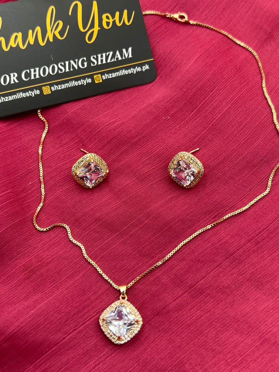 Pink Square Crystal Halo Necklace and Earrings Set on red fabric