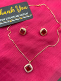 Ruby Red Square Crystal Halo Necklace and Earrings Set on red fabric