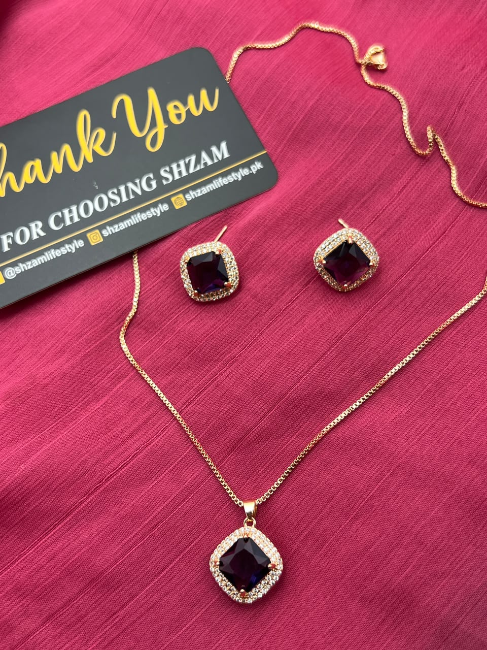 Amethyst Purple Square Crystal Halo Necklace and Earrings Set on red fabric