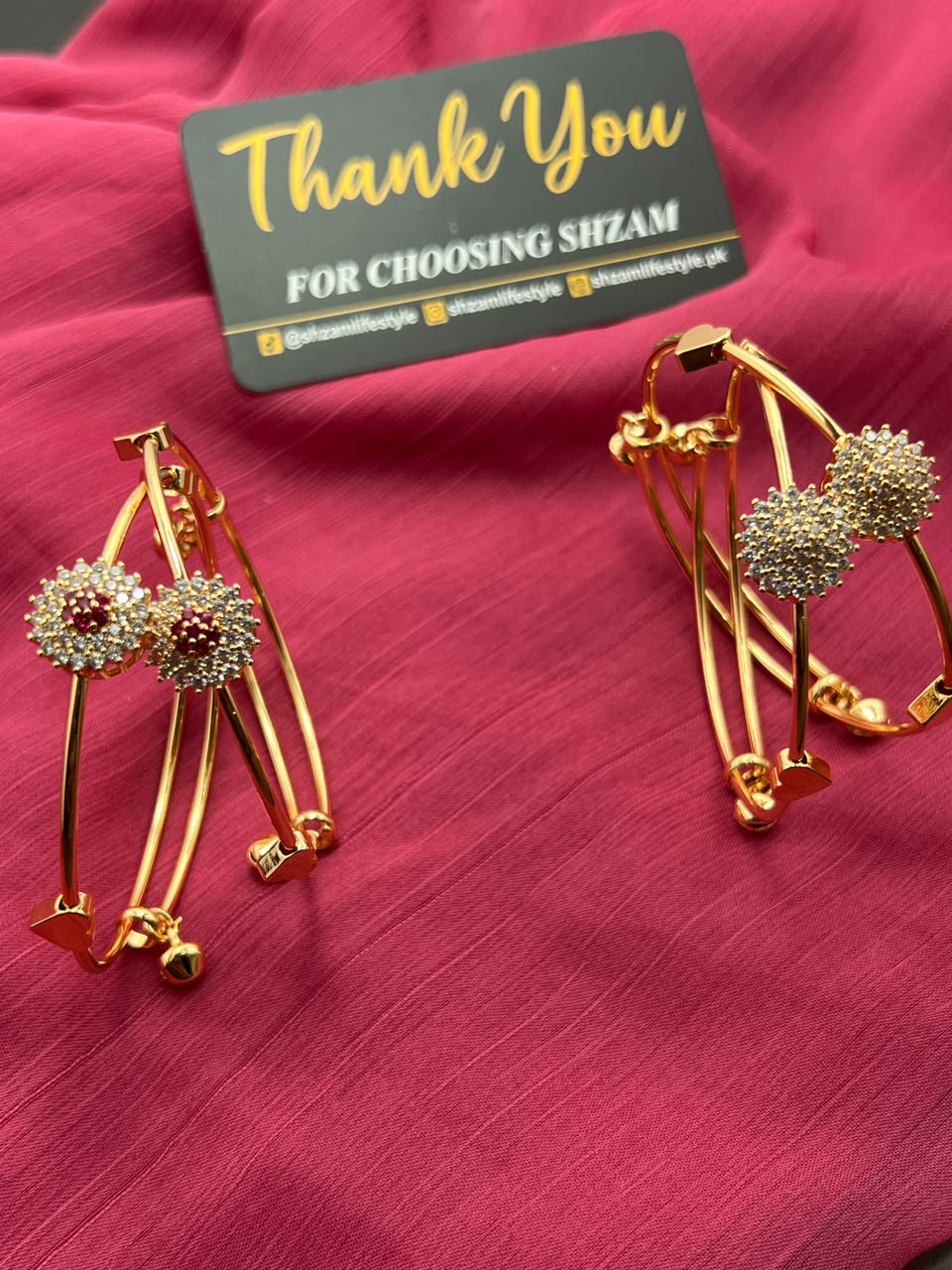 Single Gold Crystal Flower Cuff Bangle Ruby Red variant standing upright showing X-bar design