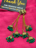 All 5 colors of Antique Gold Tiered Jhumka Earrings displayed on Shzam cards on pink fabric