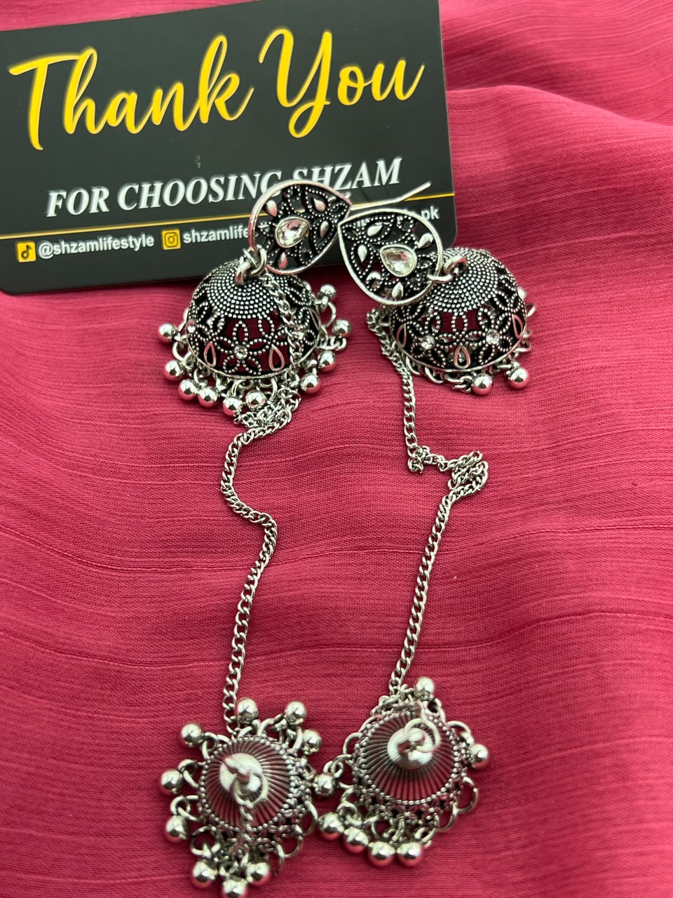 Oxidized Silver Jhumka Earrings with Chain and Tikka close-up showing dome and sunburst tikka detail