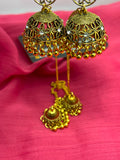 Antique Gold Jhumka Earrings close-up showing filigree cutwork crystal accents and gold ball fringe