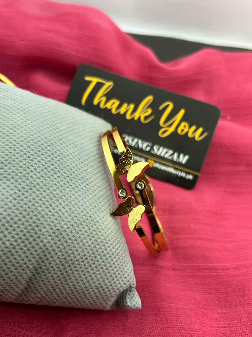 Gold butterfly bangle close up