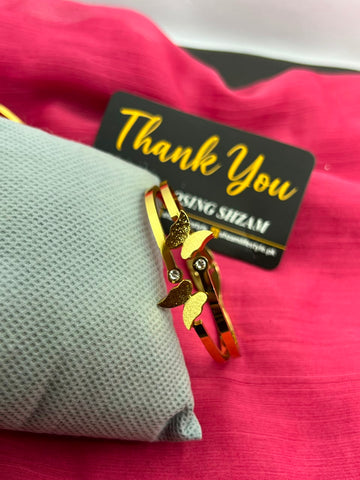 Gold butterfly bangle close up