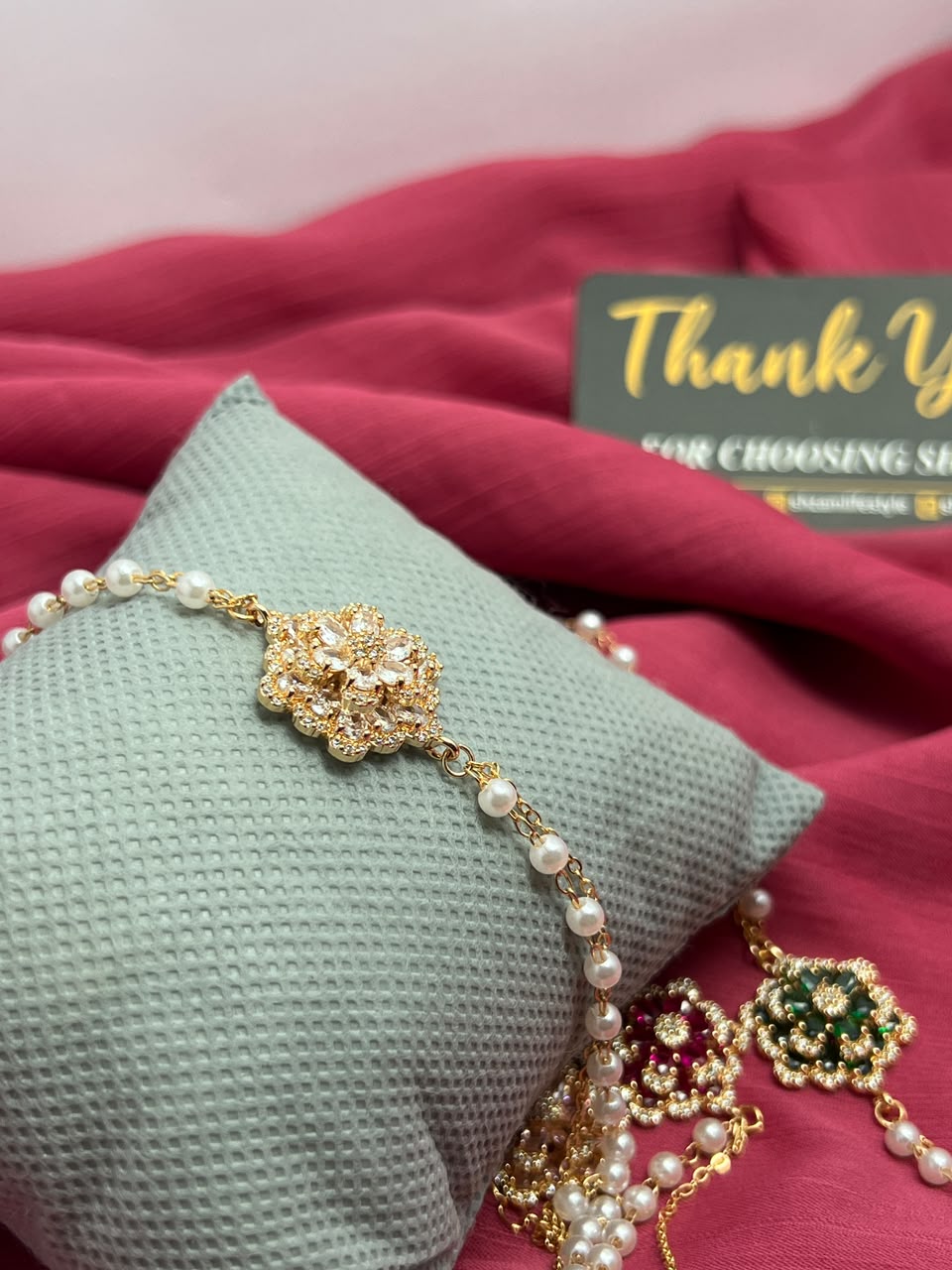 Pink Crystal Flower Pearl Bracelet on pillow with Shzam thank you card