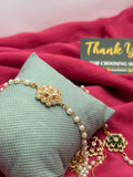 Emerald Green Crystal Flower Pearl Bracelet on pillow with Shzam thank you card
