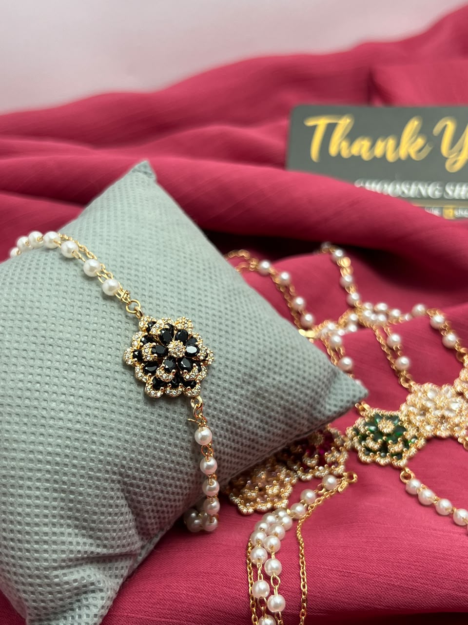 Pearl bracelet clasp and extender chain close-up detail