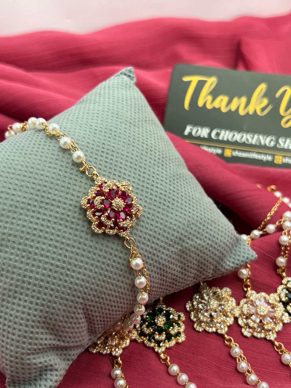 White Clear Crystal Flower Pearl Bracelet on pillow with Shzam thank you card