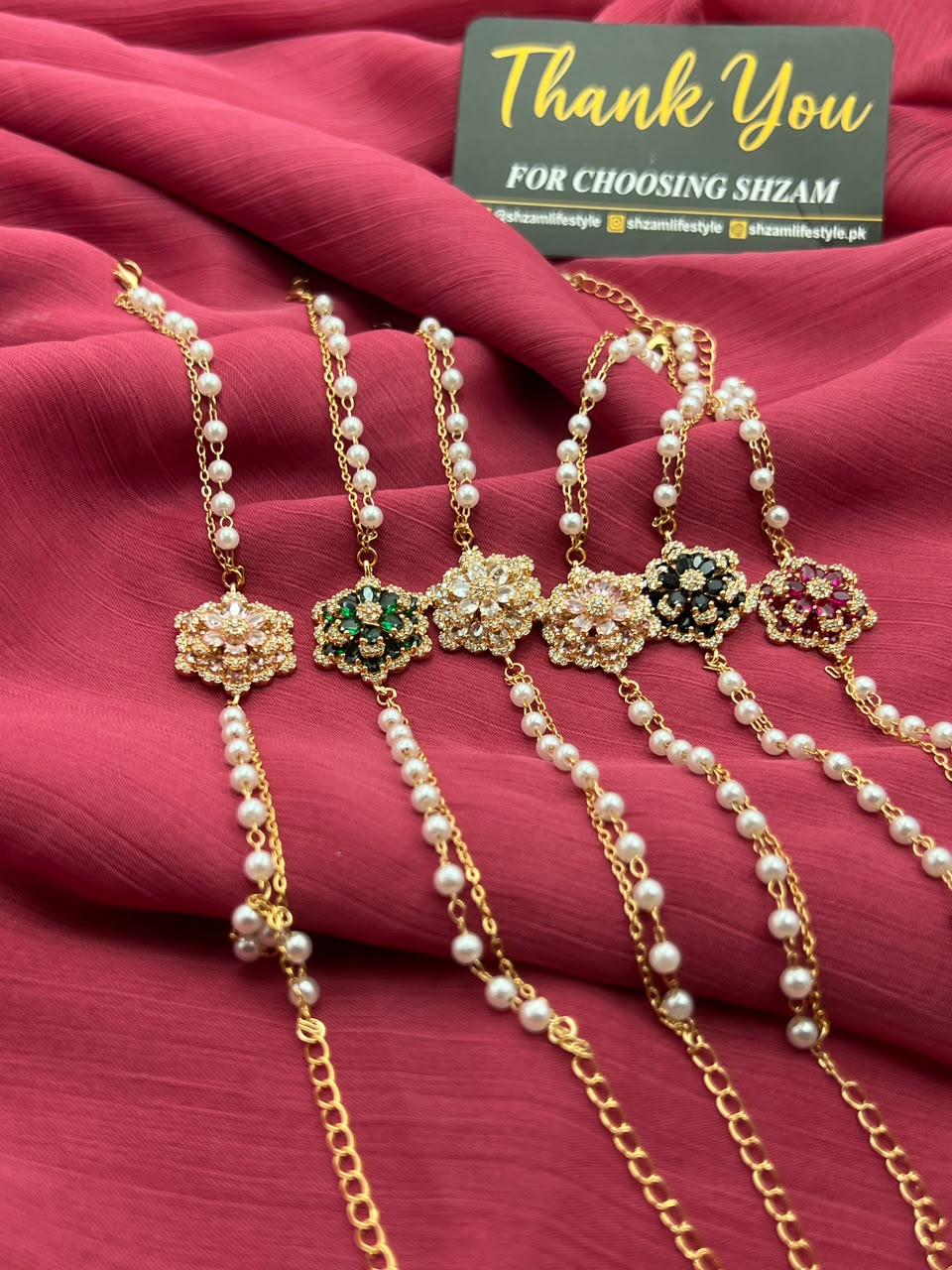 Pink Crystal Flower Pearl Bracelet on pillow with Shzam thank you card