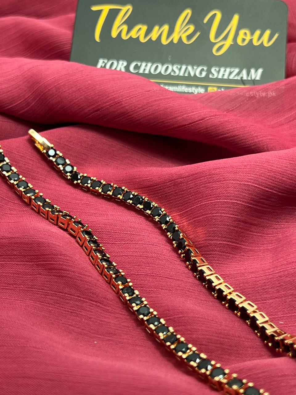 Black Diamond Tennis Bracelet flat lay close-up showing prong setting detail
